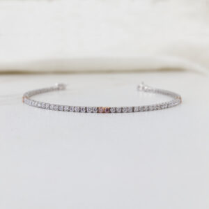 white gold tennis bracelet with pink diamonds